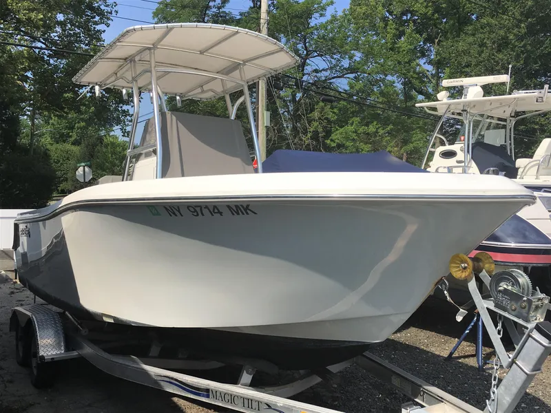 Slide: The Image of 2016 Release 208 RX boat on trailer outdoors. - 2
