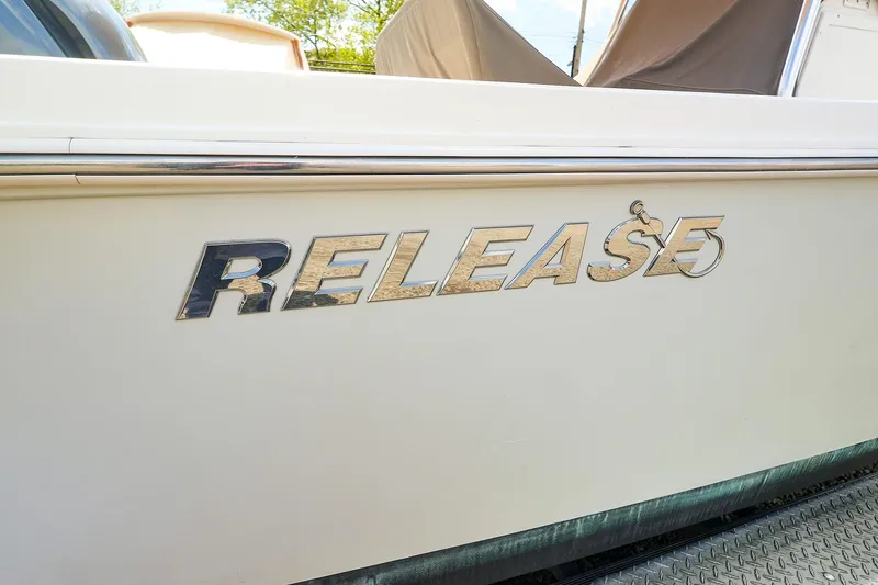 Slide: The Image of 2016 Release 208 RX boat side view with logo. - 23