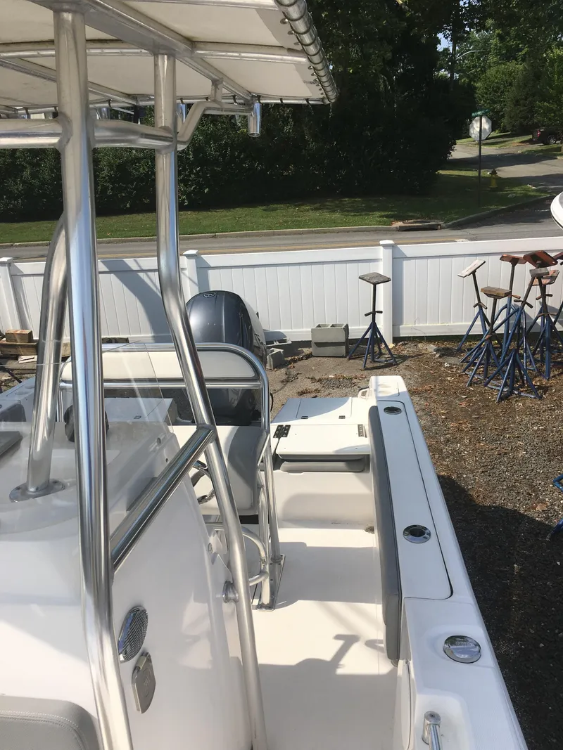 Slide: The Image of 2016 Release 208 RX boat parked outdoors. - 5