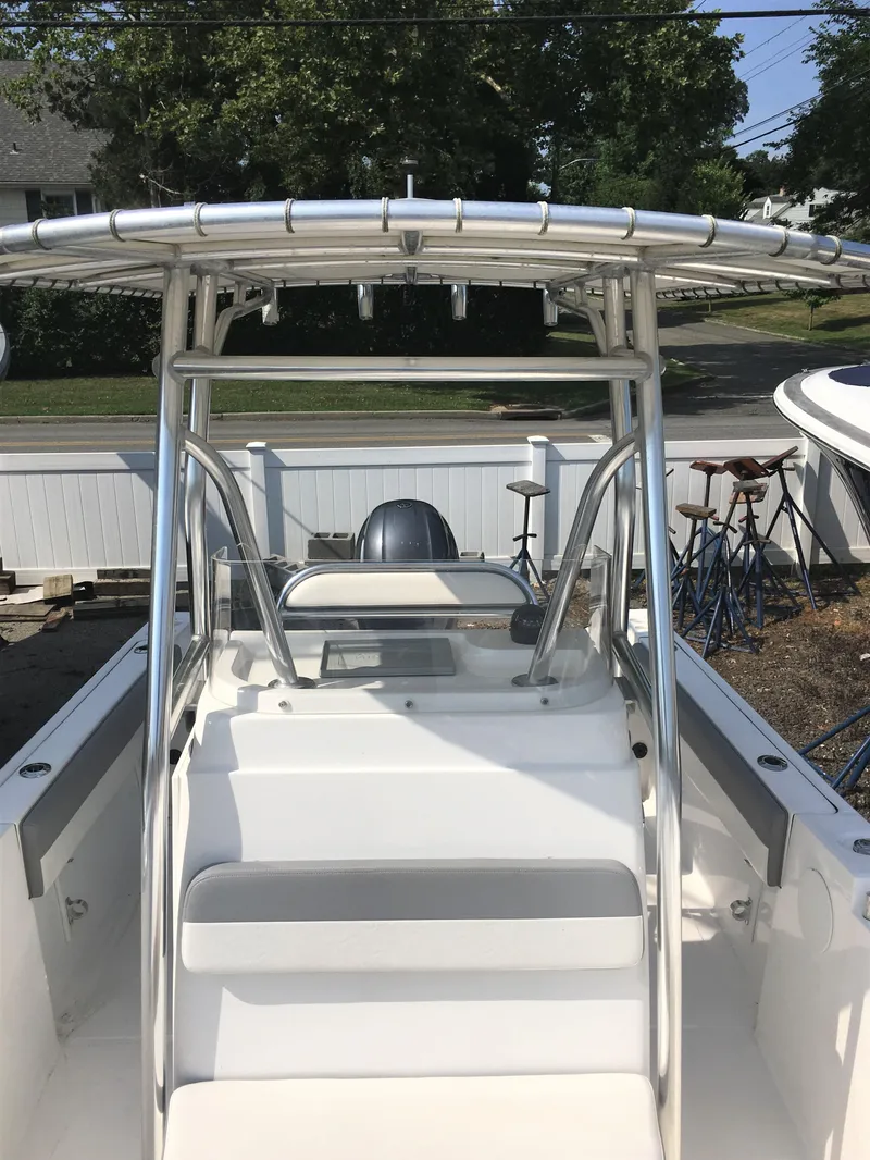 Slide: The Image of 2016 Release 208 RX boat with T-top and helm console. - 6