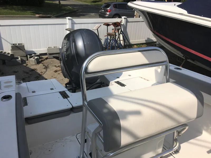 Slide: The Image of Interior view of a 2016 Release 208 RX boat with outboard motor. - 7
