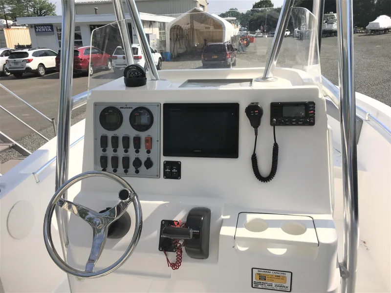 Slide: The Image of 2016 Release 208 RX boat console with steering wheel and instruments. - 8