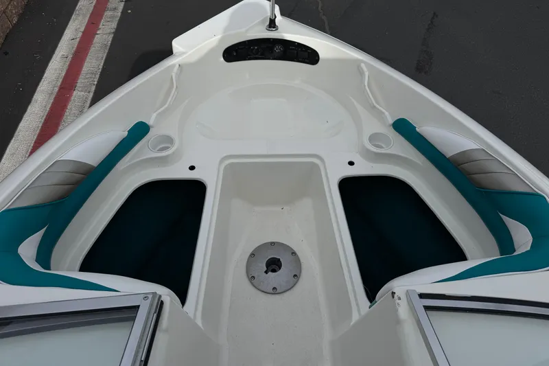 Slide: The Image of 1997 Glastron GS 185 boat interior with teal and white seating. - 10
