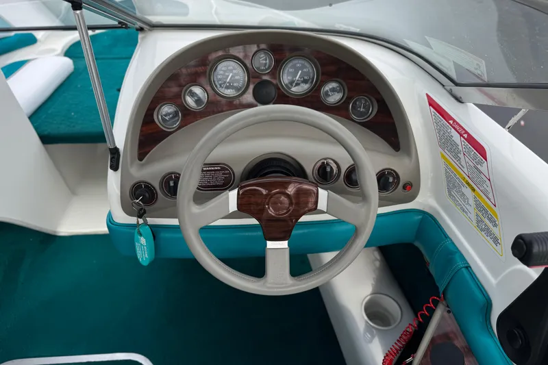 Slide: The Image of 1997 Glastron GS 185 boat dashboard with steering wheel and instrument panel. - 20