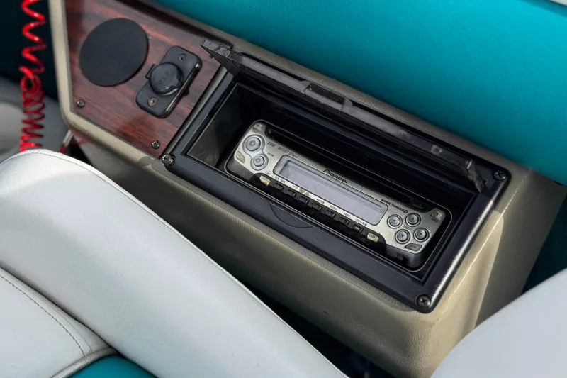 Slide: The Image of 1997 Glastron GS 185 boat dashboard with Pioneer stereo system and teal upholstery. - 21