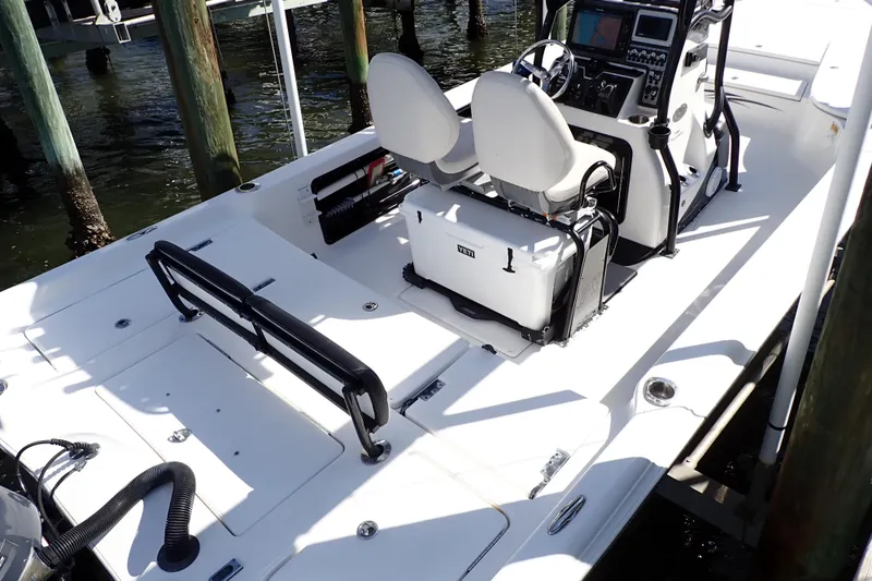 Slide: The Image of 2015 Blue Wave 2400 PureBay boat interior with dual seats and control panel. - 5