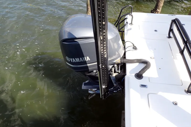 Slide: The Image of 2015 Blue Wave 2400 PureBay boat with Yamaha outboard motor in water. - 6