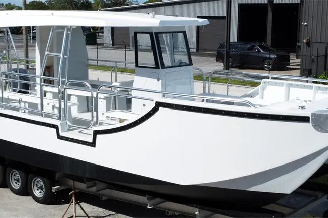 Slide: The Image of Custom BYD 34 boat, 2027 model, white exterior, docked on a trailer. - 4