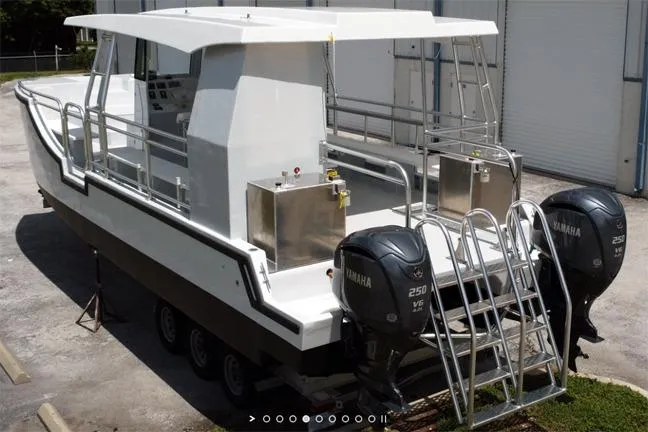 Slide: The Image of Custom BYD 34 boat, 2027 model, featuring dual Yamaha 250 V6 engines, docked outdoors. - 5