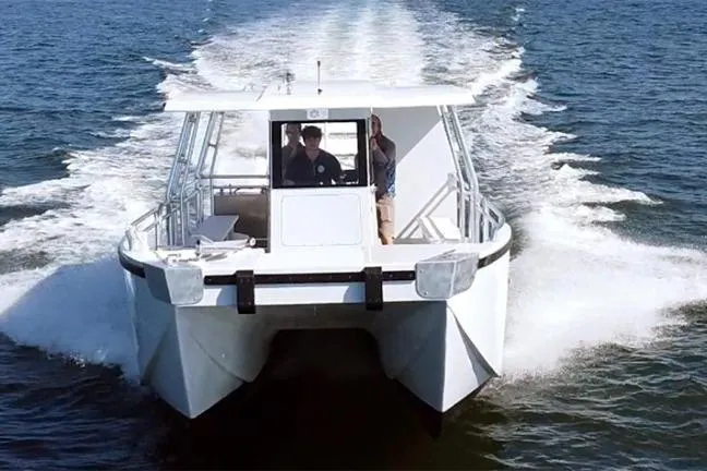 Slide: The Image of Custom BYD 34 catamaran cruising on open water, 2027 model. - 9