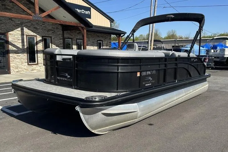Slide: The Image of 2022 Bennington 20 SLMX boat interior with gray seating and shadow on deck. - 10