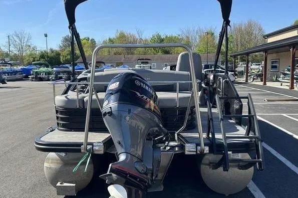Slide: The Image of 2022 Bennington 20 SLMX boat interior with steering wheel and seating area. - 11
