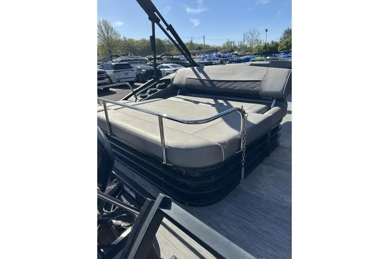 Slide: The Image of 2022 Bennington 20 SLMX pontoon boat interior with gray seating and table. - 9
