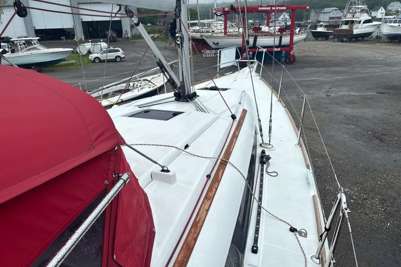Slide: The Image of 2017 Jeanneau Sun Odyssey 389 sailboat on land at a shipyard. - 21