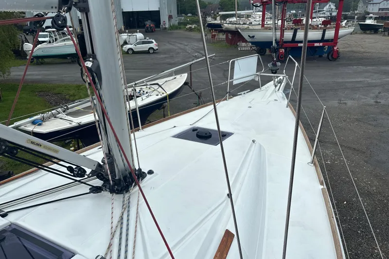 Slide: The Image of 2017 Jeanneau Sun Odyssey 389 sailboat on land, showcasing deck and rigging. - 23