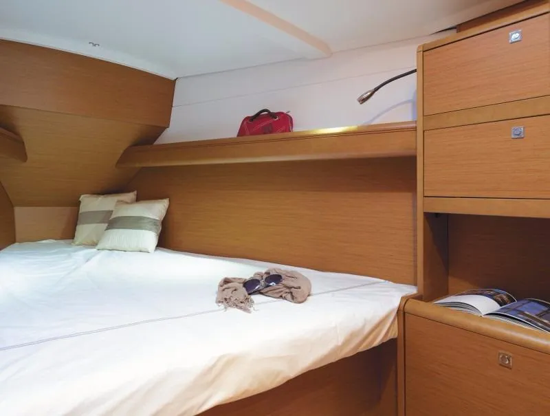 Slide: The Image of Manufacturer Provided Image: Cozy cabin interior of 2017 Jeanneau Sun Odyssey 389 sailboat with wooden finish. - 57