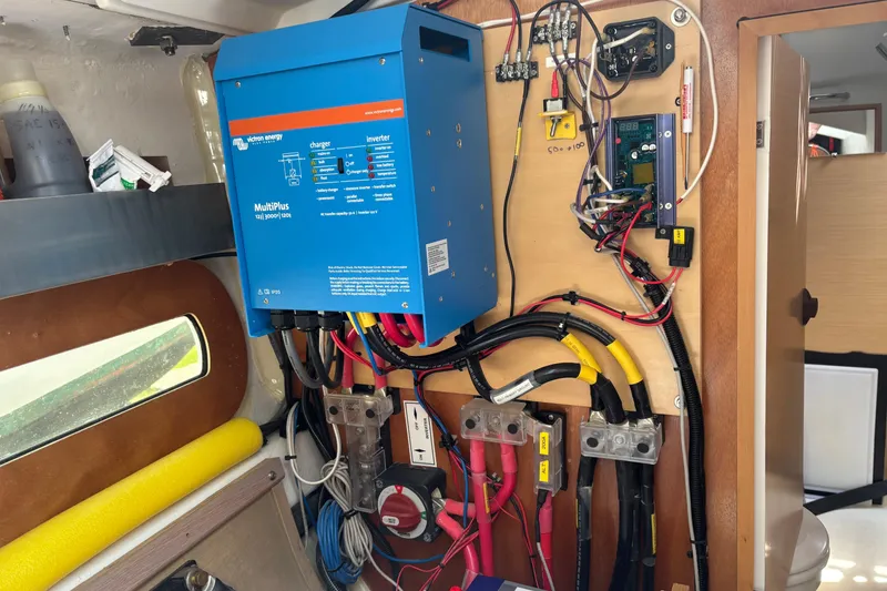 Slide: The Image of Electrical system setup in a 2017 Jeanneau Sun Odyssey 389 sailboat, featuring a Victron Energy MultiPlus inverter. - 62
