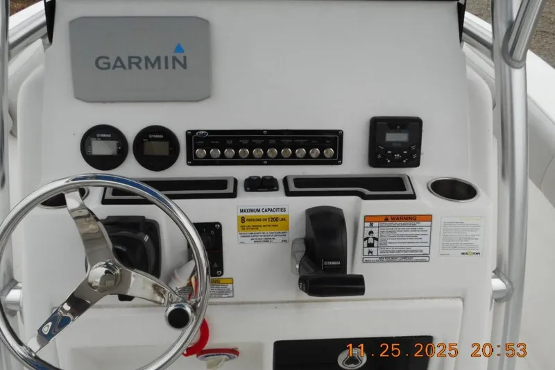 Slide: The Image of 2021 Sea Fox 228 Commander dashboard with Garmin navigation, steering wheel, and controls. - 13