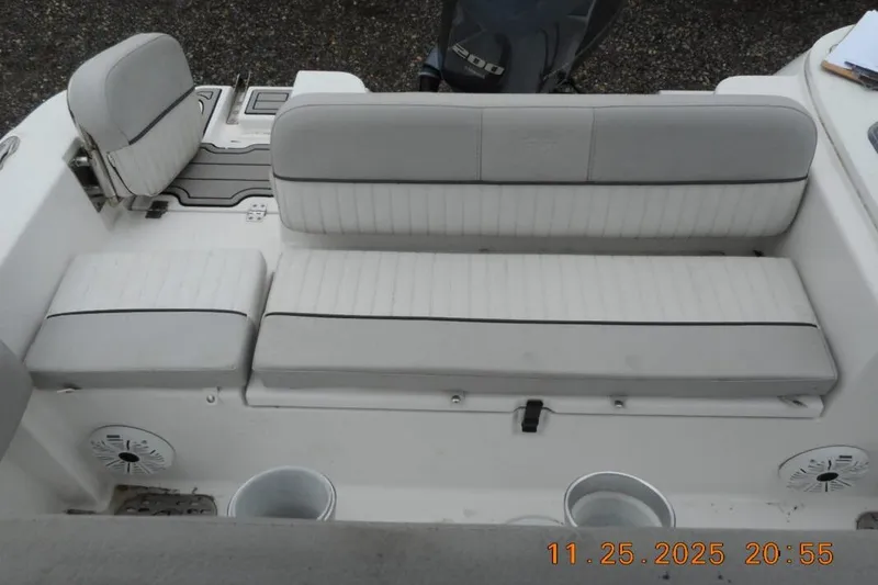 Slide: The Image of 2021 Sea Fox 228 Commander boat seating area with white cushioned seats and speakers. - 14