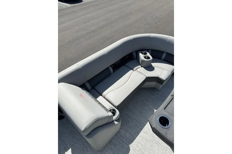 Slide: The Image of 2022 Bennington 22 LSR boat interior with gray seating and cup holders. - 10