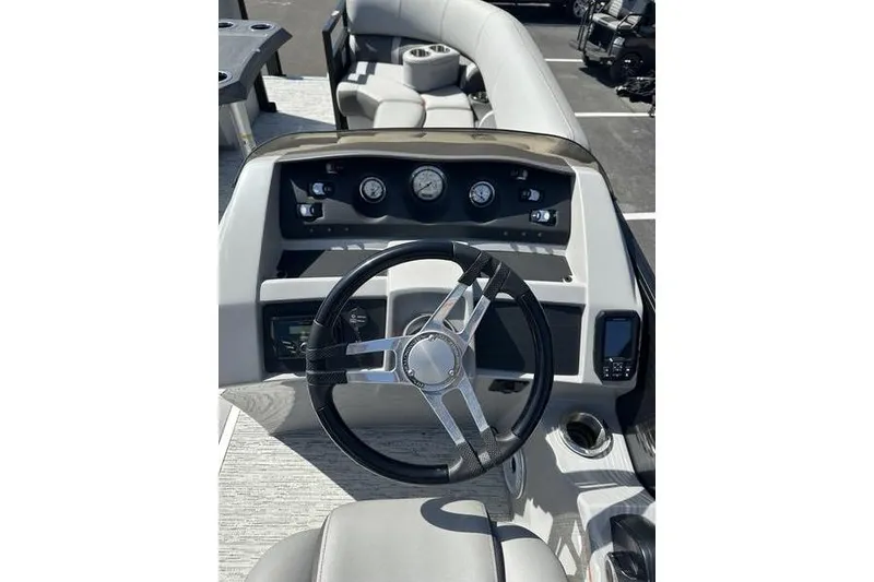Slide: The Image of 2022 Bennington 22 LSR boat dashboard with steering wheel and gauges. - 12