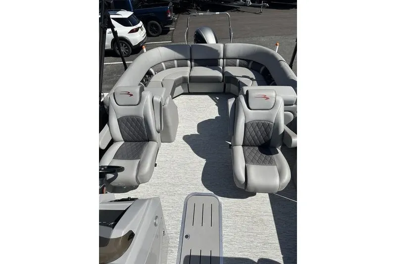 Slide: The Image of 2022 Bennington 22 LSR pontoon boat with luxurious gray seating and spacious deck. - 14