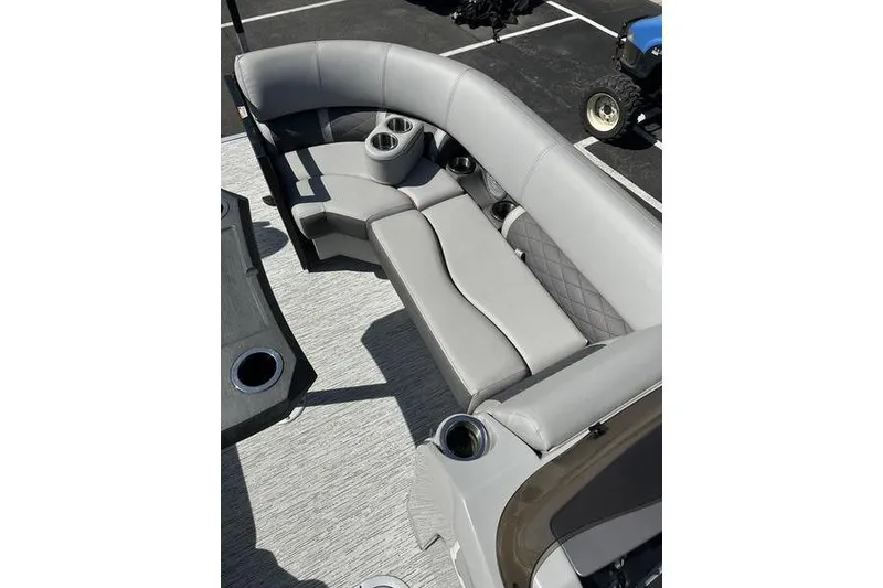 Slide: The Image of 2022 Bennington 22 LSR boat interior with gray seating and cup holders. - 7