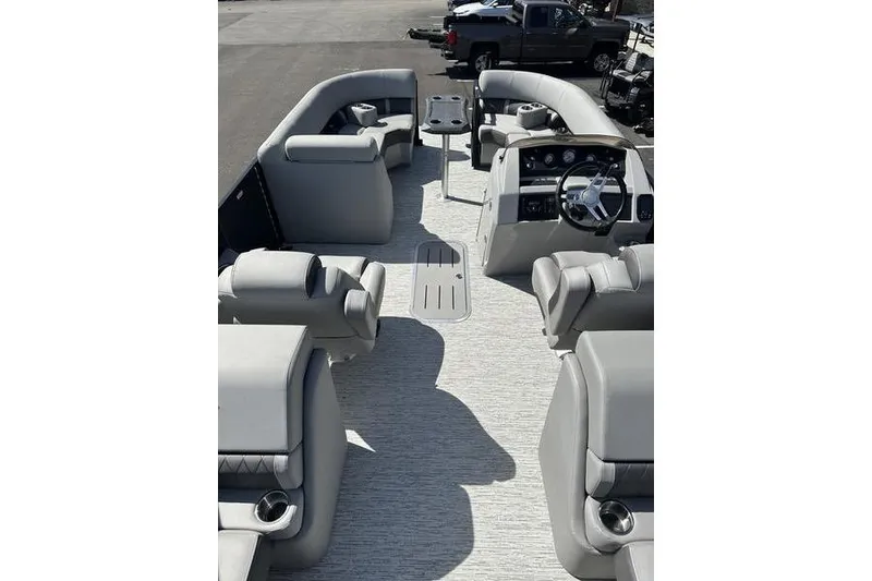 Slide: The Image of 2022 Bennington 22 LSR pontoon boat interior with plush seating and modern dashboard. - 8