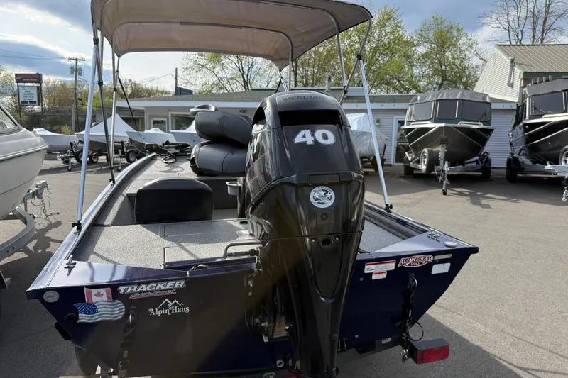 Slide: The Image of 2019 Bass Tracker Pro 17 boat with Mercury 40 engine, parked outdoors. - 11