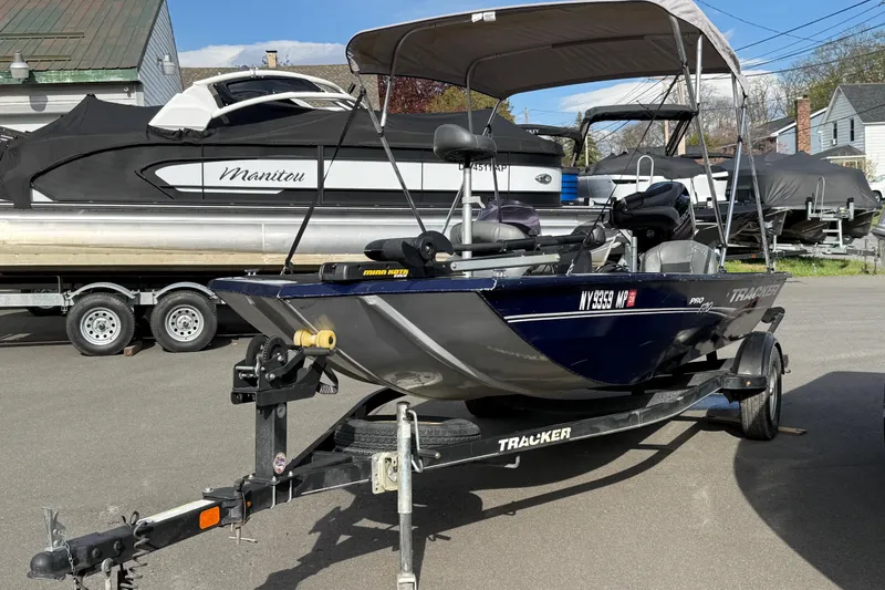 Slide: The Image of 2019 Bass Tracker Pro 17 boat on trailer, parked outdoors. - 13