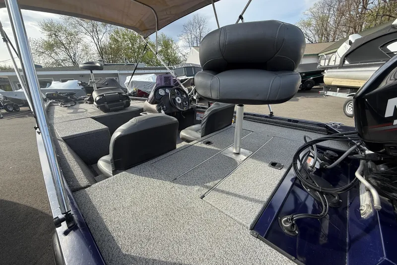 Slide: The Image of 2019 Bass Tracker Pro 17 boat interior with seating and steering console. - 8