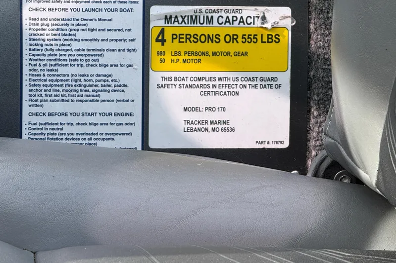 Slide: The Image of Bass Tracker Pro 17 boat capacity label, 4 persons or 555 lbs, safety instructions visible. - 9