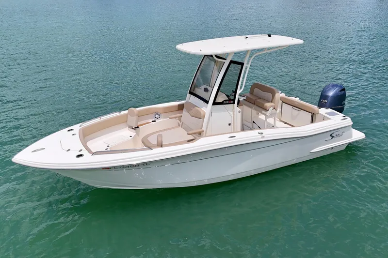 The Image of 2023 Scout 215 XSF boat on clear water, featuring sleek design and modern amenities. - 0