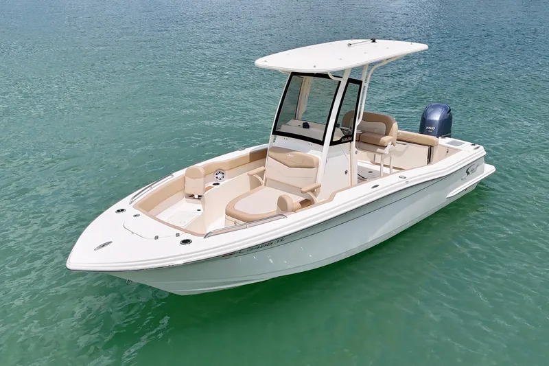 Slide: The Image of 2023 Scout 215 XSF boat on clear water, featuring sleek design and modern amenities. - 2
