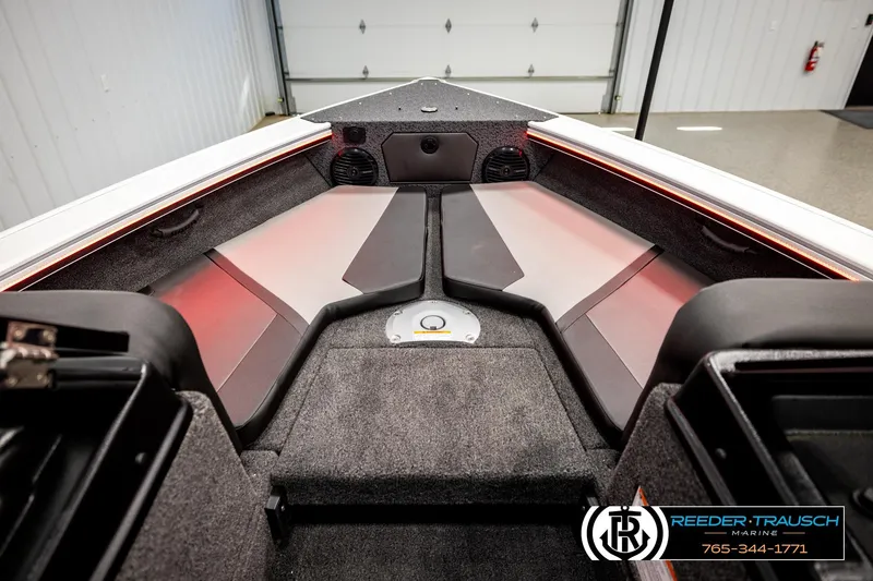 Slide: The Image of 2026 Lund 1875 Crossover XS boat interior with modern seating and storage compartments. - 25