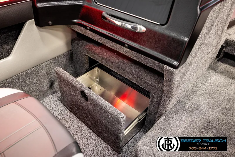 Slide: The Image of Interior of 2026 Lund 1875 Crossover XS boat with open storage compartment. - 31