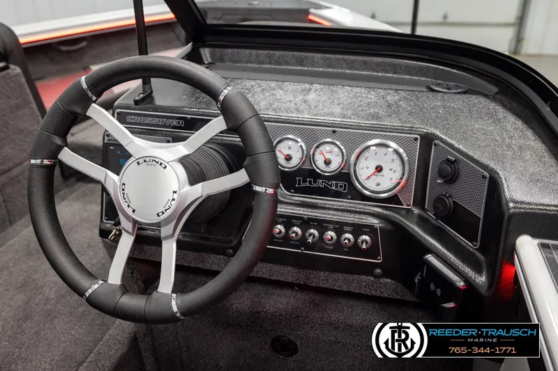 Slide: The Image of Steering wheel and dashboard of 2026 Lund 1875 Crossover XS boat. - 34