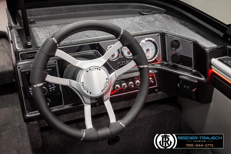 Slide: The Image of Steering wheel and dashboard of 2026 Lund 1875 Crossover XS boat. - 35