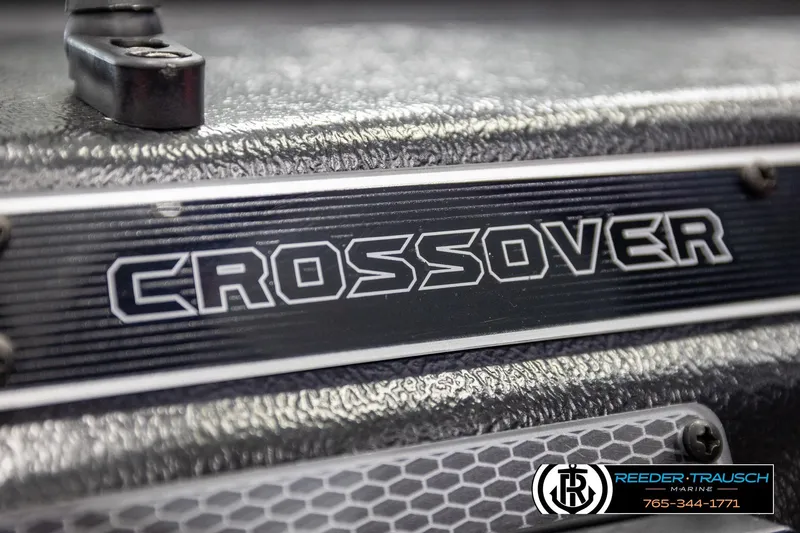 Slide: The Image of Close-up of 2026 Lund 1875 Crossover XS boat logo with textured surface. - 38