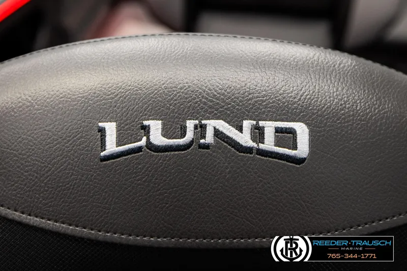 Slide: The Image of Close-up of Lund logo on 2026 Lund 1875 Crossover XS boat seat. - 46