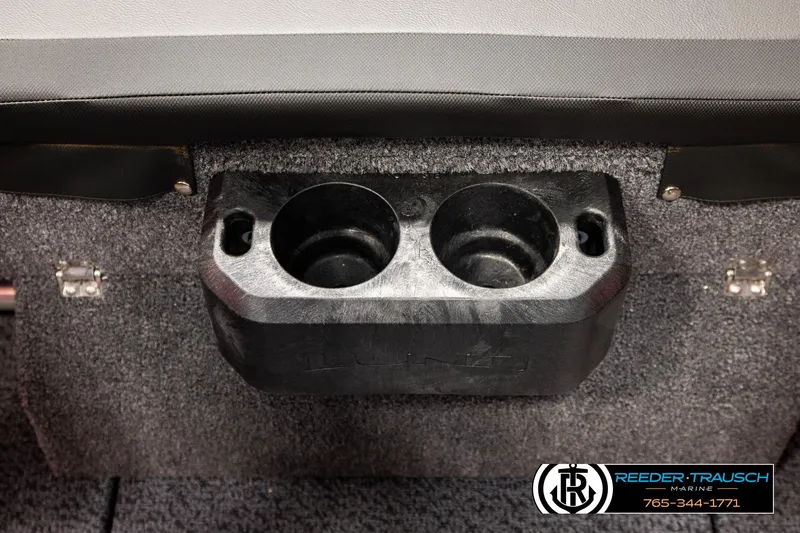 Slide: The Image of Cup holders in 2026 Lund 1875 Crossover XS boat interior, featuring Reeder-Trausch Marine branding. - 48