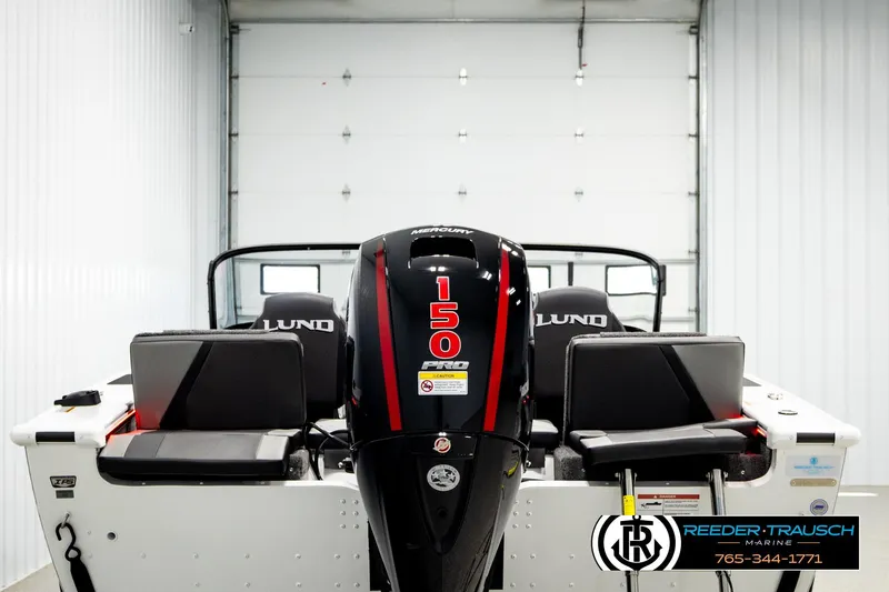 Slide: The Image of 2026 Lund 1875 Crossover XS boat with Mercury 150 Pro motor in showroom. - 5
