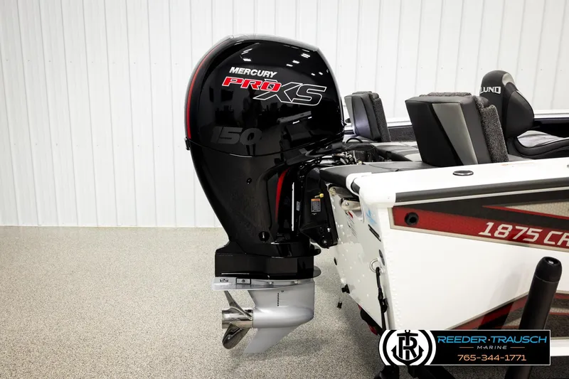 Slide: The Image of 2026 Lund 1875 Crossover XS boat with Mercury Pro XS 150 engine in showroom. - 52