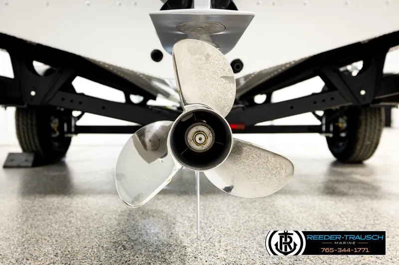Slide: The Image of Close-up of a 2026 Lund 1875 Crossover XS boat propeller on a trailer. - 55