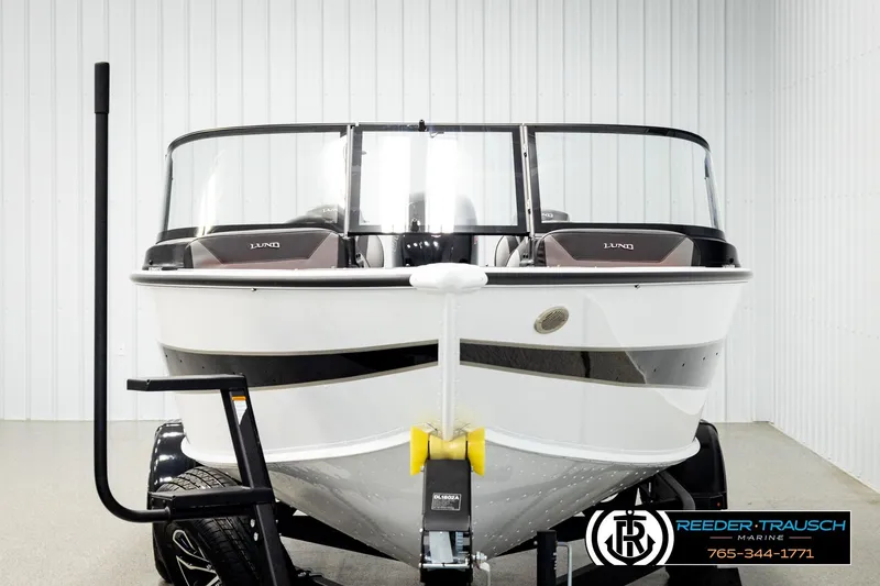 Slide: The Image of 2026 Lund 1875 Crossover XS boat on trailer in showroom, front view. - 6