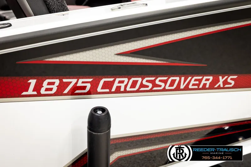 Slide: The Image of 2026 Lund 1875 Crossover XS boat with bold red and white graphics. - 62