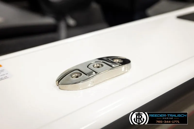 Slide: The Image of Close-up of a 2026 Lund 1875 Crossover XS boat cleat on a white surface. - 63