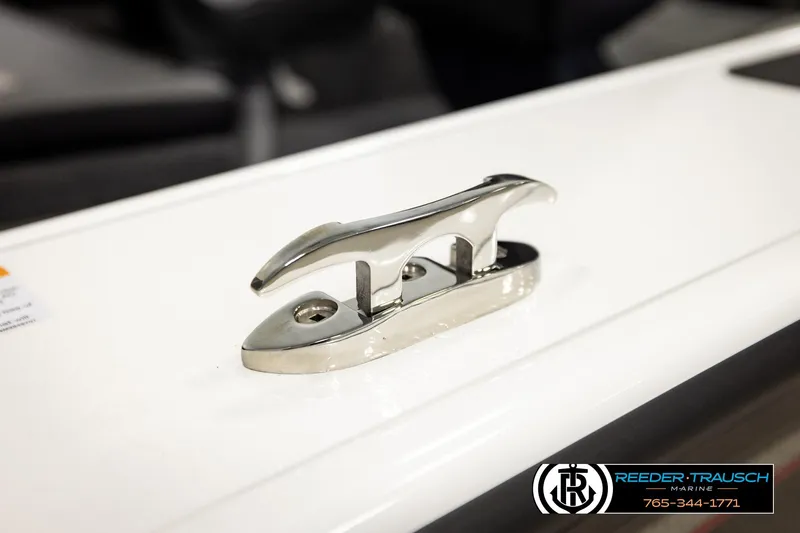 Slide: The Image of 2026 Lund 1875 Crossover XS boat cleat detail, Reeder-Trausch Marine branding visible. - 64