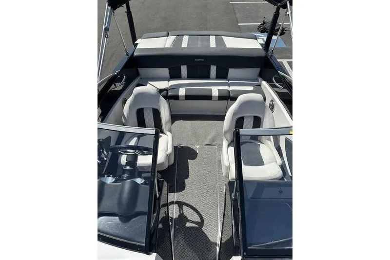 Slide: The Image of 2015 Glastron GT 185 boat interior with seating and steering wheel. - 14