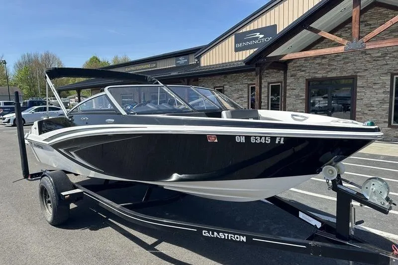Slide: The Image of 2015 Glastron GT 185 boat on trailer outside dealership. - 5